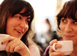 Two women chat over coffee, a photo by Drew Herron