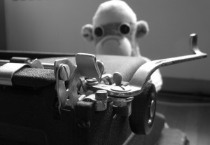 Monkey sitting a typewriter, photo by Corinna A. Carlson